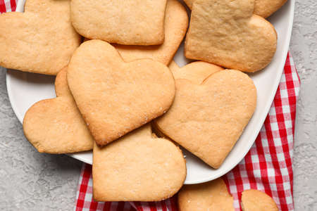 Plate with tasty heart shaped cookies on table, closeup. valentine's day celebrationの写真素材