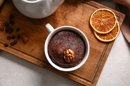 Cup with tasty chocolate brownie on table