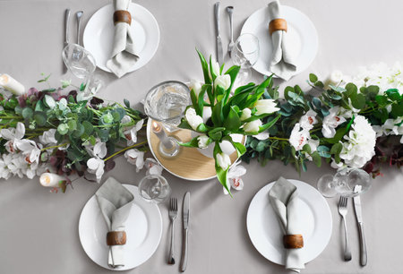Stylish table setting with tulip flowersの写真素材