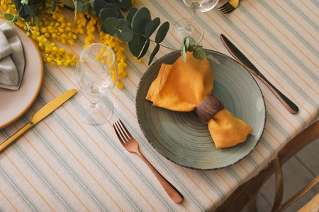 Dining table with beautiful setting and floral decor