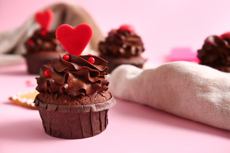 Tasty chocolate cupcake for Valentine's day on pink background, closeupの写真素材