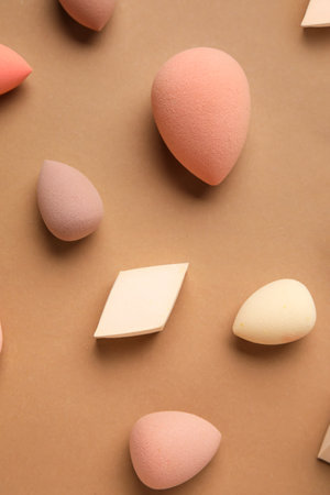 Different makeup sponges on brown backgroundの写真素材