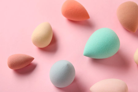 Different makeup sponges on pink background, closeupの写真素材