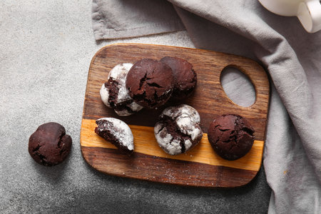 Wooden board of chocolate brownie cookies on grunge backgroundの写真素材