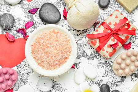 Beautiful spa composition with stones for Valentine's Day celebration on gray background