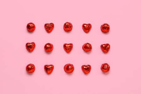 Heart shaped candies on pink background. St. Valentine's Dayの写真素材