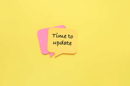 Sticky notes on yellow background. Time to update