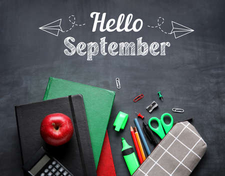 School stationery and apple on blackboard. Hello Septemberの写真素材
