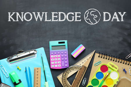 School stationery on dark blackboard. Knowledge Dayの写真素材