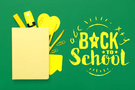 Yellow stationery and text BACK TO SCHOOL on green background