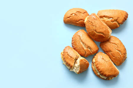 Tasty sochniki with cottage cheese on blue backgroundの写真素材