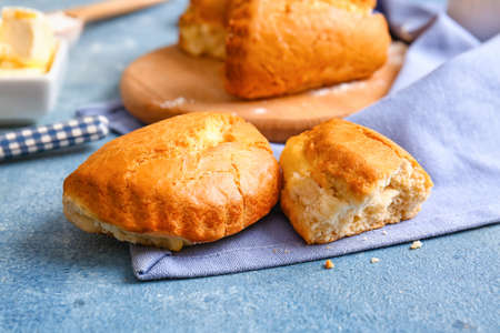 Tasty sochniki with cottage cheese on blue background