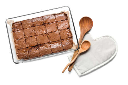 Baking dish with tasty chocolate brownie isolated on white background