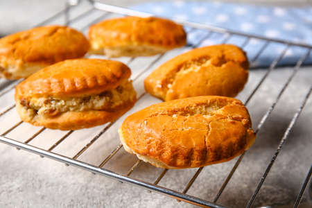 Grid of tasty sochniki with cottage cheese on gray background, closeup
