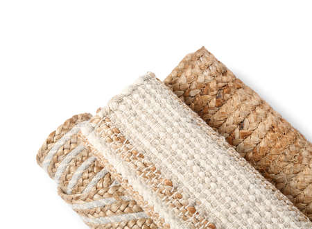 Rolled carpets on white background, closeup