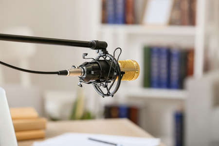 Stand with modern microphone in room, closeupの写真素材