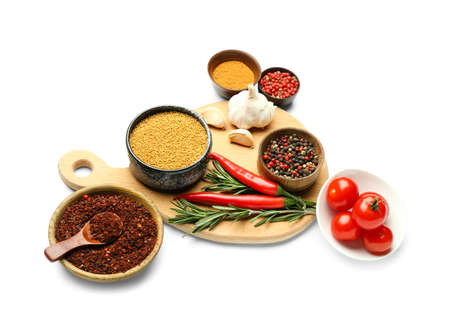 Composition with spices and vegetables on white backgroundの写真素材