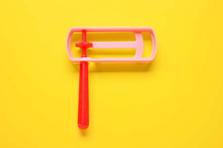 Jewish rattle on yellow background