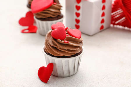 Tasty chocolate cupcakes for Valentine's Day on white backgroundの写真素材