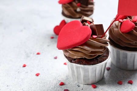 Tasty chocolate cupcakes for Valentine's Day on light backgroundの写真素材