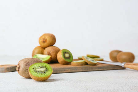 Fresh ripe kiwi on light background