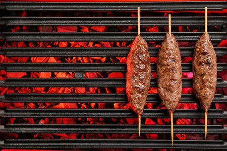 Skewers with tasty lula kebab on grillの写真素材
