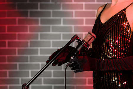 Female singer with professional microphoneの写真素材