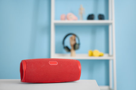 Wireless portable speaker on table in roomの写真素材