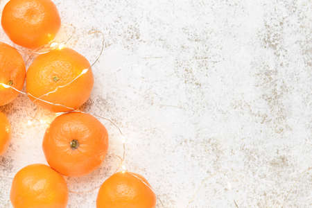 fresh tangerines on light backgroundの写真素材