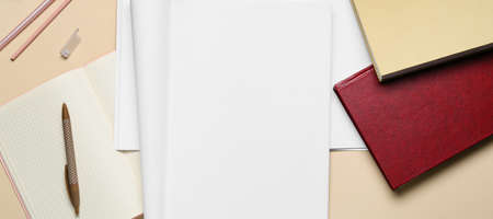 Blank magazines with notebooks on light backgroundの写真素材