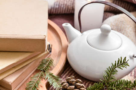 Stack of books and teapot, closeupの写真素材
