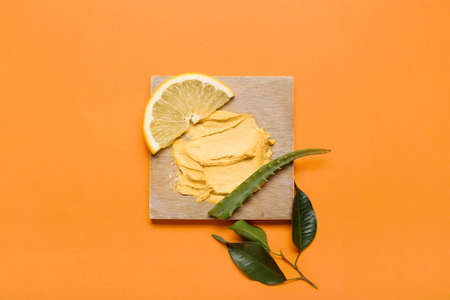 Turmeric mask, lemon and aloe on orange backgroundの写真素材