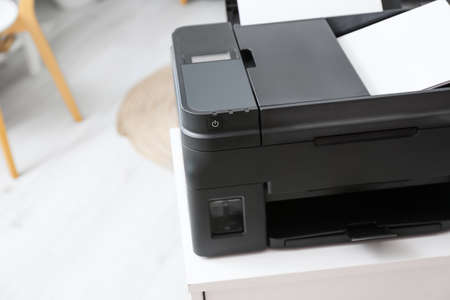 Modern printer on chest of drawers, closeupの写真素材