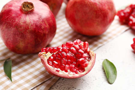 Ripe delicious pomegranate on light background
