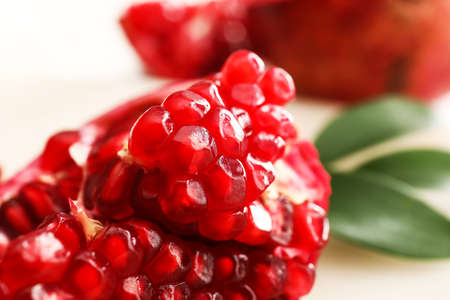 Ripe delicious pomegranate on light background
