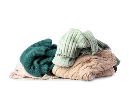 Different crumpled sweaters on white backgroundの写真素材