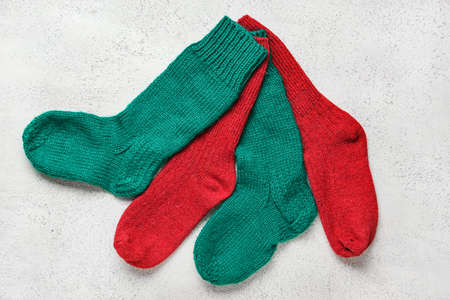 Warm knitted socks on light backgroundの写真素材