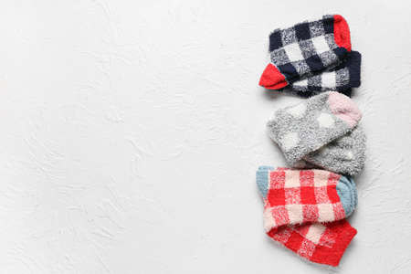 Set of warm socks on light backgroundの写真素材