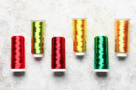 Sewing threads on light background