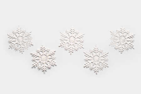 Stylish snowflakes on light backgroundの写真素材