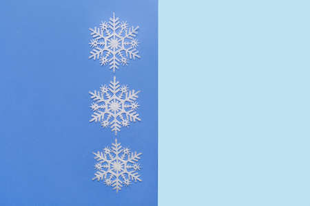 Stylish snowflakes on blue background