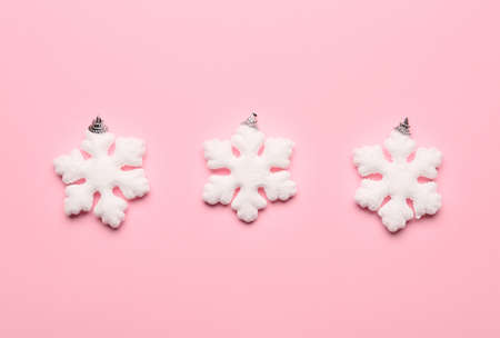 Stylish snowflakes on pink background