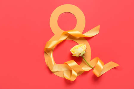 Composition with beautiful flower for International Women's Day on red background