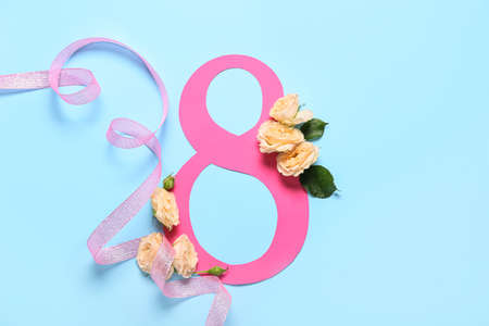 Composition with beautiful flowers for International Women's Day on blue backgroundの写真素材