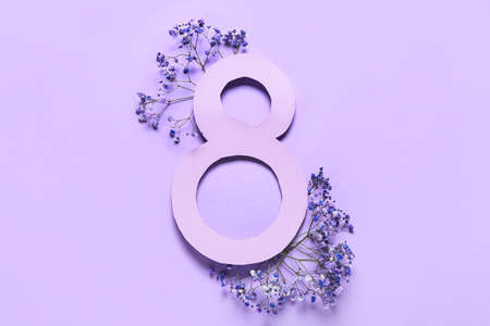 Composition with beautiful flowers for International Women's Day on purple backgroundの写真素材