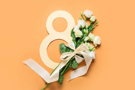 Composition with beautiful flowers for International Women's Day on color backgroundの写真素材