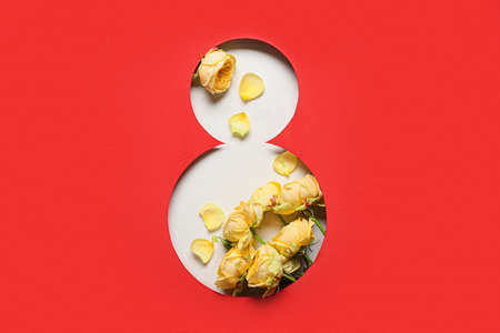 Composition with beautiful flowers for International Women's Day on red backgroundの写真素材