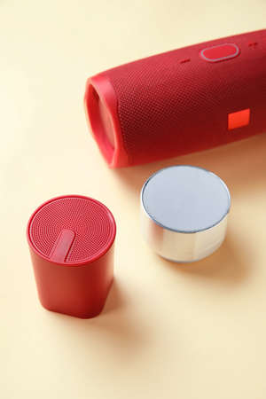 Different wireless portable speakers on color background, closeupの写真素材