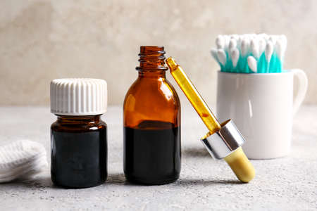 Bottles with iodine and pipette on grunge backgroundの写真素材