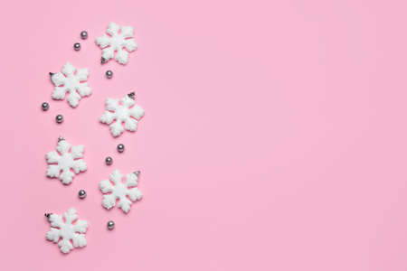 Beautiful snowflakes on pink background